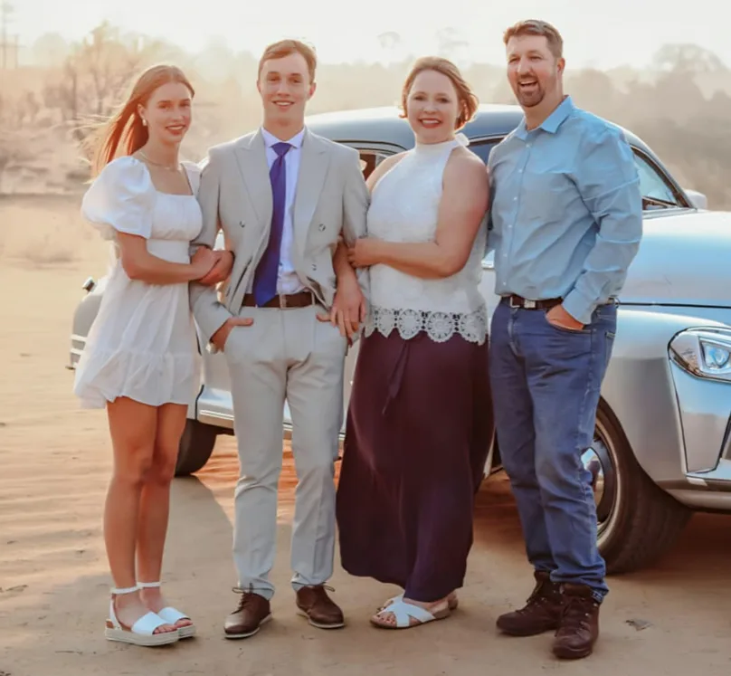 Aloe Africa Hunting Safaris Gunther family owners posing together at golden hour in South Africa